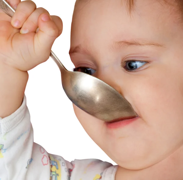 Bebê menina segurando colher na boca — Fotografia de Stock