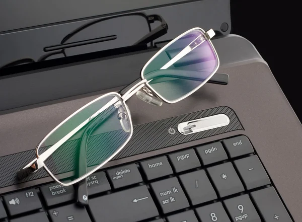 Glasses on laptop — Stock Photo, Image