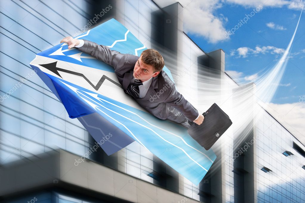 Businessman flying on airpaper plane