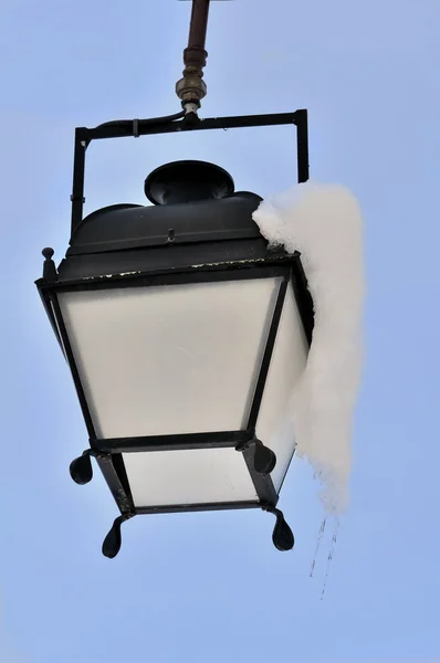 Closeup of a lantern with snow Stock Photo
