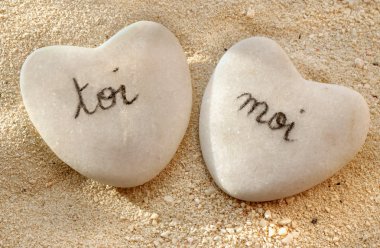 French you and me hearts of pebbles in the sand clipart