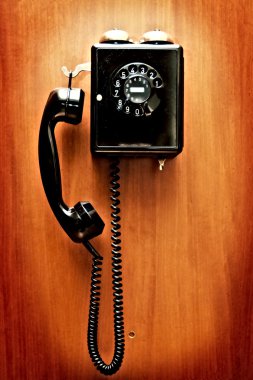 Phone hangs on a wall clipart