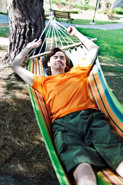 The young man has a rest in a hammock — Stock Photo, Image