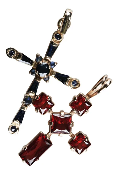 Female ornament - a gold cross with a pomegranate and sapphire — Stock Photo, Image