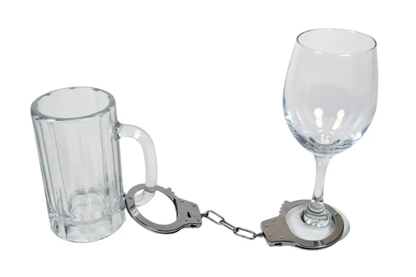 Handcuffs on Beer Mug and Wine Glass — Stock Photo, Image