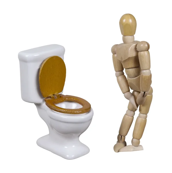 Model in nood naast een porseleinen toilet — Stockfoto