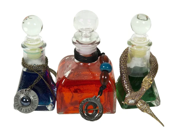 Färgglada potion flaskor med berlocker — Stockfoto