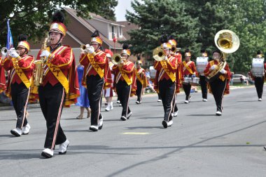 Henry Sibley High School Marching Band Performing in a Parade clipart