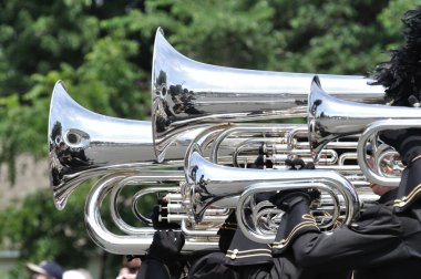 Waconia High School Marching Band Performing in a Parade clipart