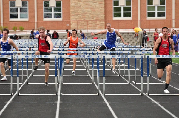 Teen Boys Competing in High School Hurdles Race — Stock Photo, Image