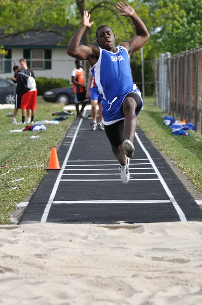 Teen Boy Doing the Long Jump at a High School Track and Field Meet — Stock Photo, Image
