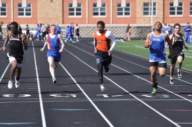 Teen Boys Competing in High School Sprint Race clipart