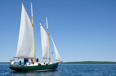 Schooner Sailboat Sailing on Lake Superior by the Apostle Islands clipart