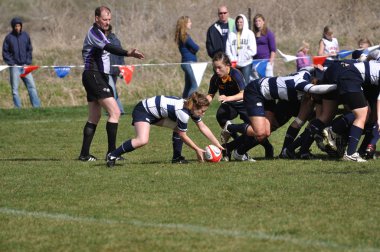 A Scrum in a Women's College Rugby Match clipart