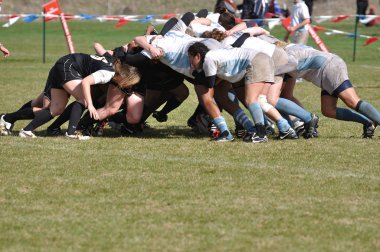 A Scrum in a Women's College Rugby Match clipart