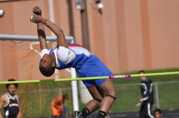 Teen Boy Doing the High Jump at a High School Track and Field Meet — Stock Photo, Image