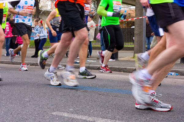 LONDON - APRIL 22: Unidentified run the London marathon on April 22, 2012 in London, England, UK. The marathon is an annual event.