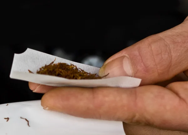 stock image Hand rolling tobacco