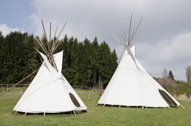 Pair of white teepee tents clipart