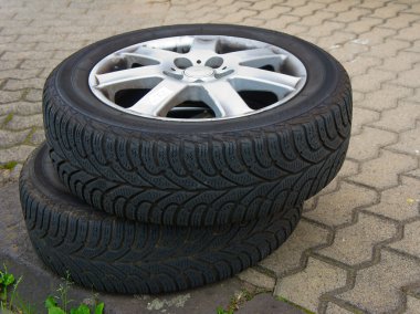 Two worn old tires with discs clipart