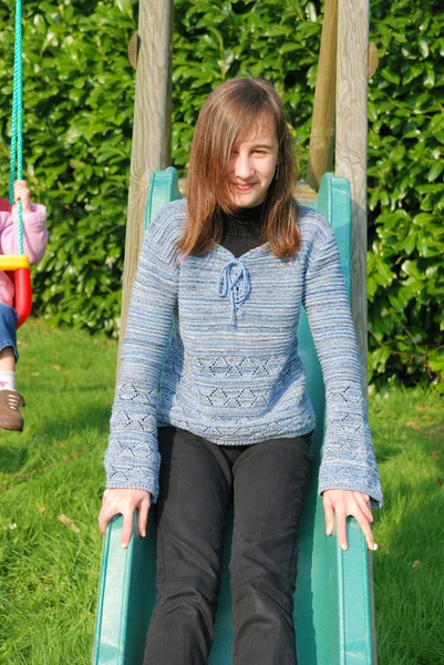 Girl on slide — Stock Photo, Image