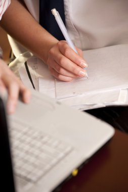 Businesspeople hands with computer and documents clipart