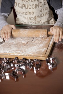 Girl making cookies clipart