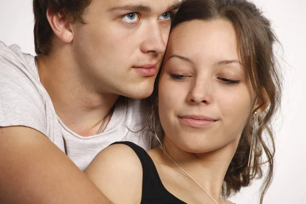 Young couple on white background — Stock Photo, Image
