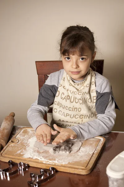 Girl making cookies — Stock Photo, Image
