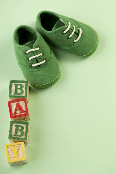 Baby shoes and blocks — Stock Photo, Image