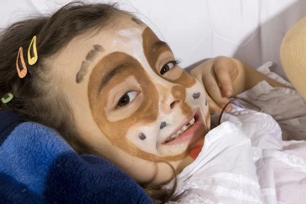 Young girl with a painted dog on her face — Stock Photo, Image