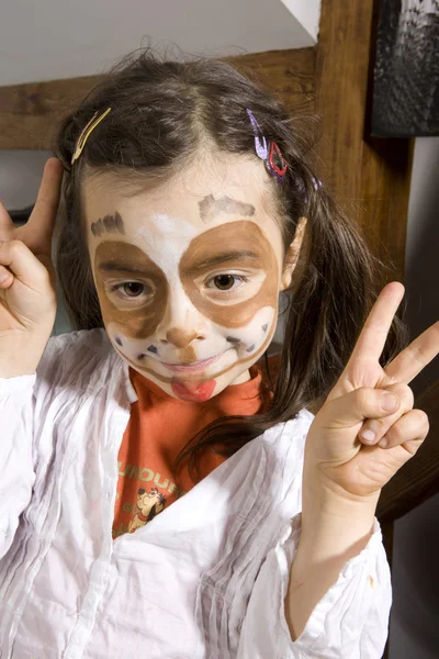 Young girl with a painted dog on her face — Stock Photo, Image