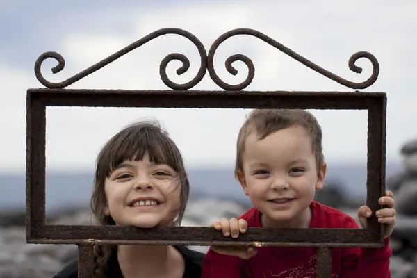 Siblings in frame — Stock Photo, Image