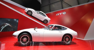 Two white Toyota 2000 GT clipart