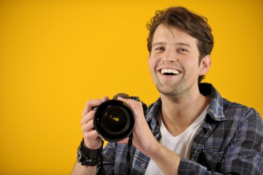 Happy photographer with SLR camera clipart