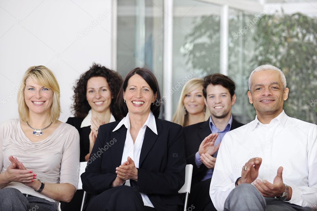 Business team applauding after a conference