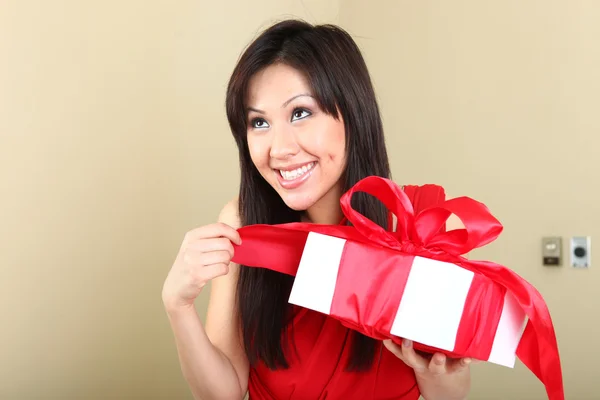 Woman Holding a Wrapped Gift Package — Stock Photo, Image
