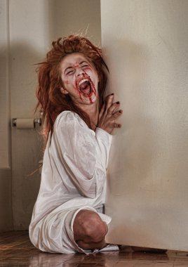 Horror Themed Image With Bleeding Freightened Woman clipart