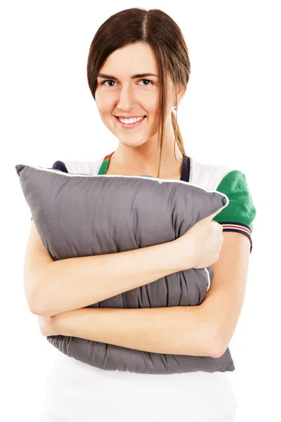 Jovem mulher bonita abraçando um travesseiro — Fotografia de Stock