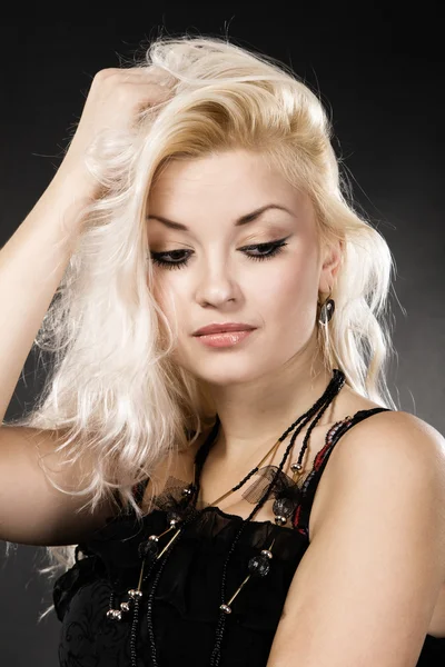 Blond model on black background, studio portrait — Stock Photo, Image