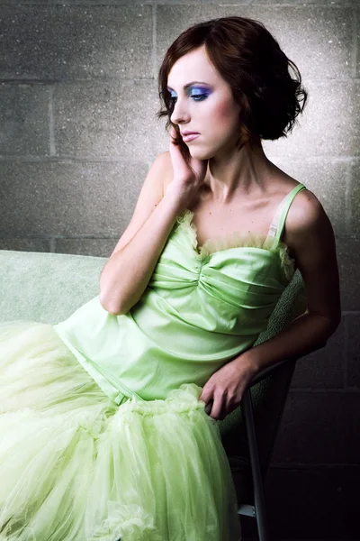 Young woman in green gown — Stock Photo, Image