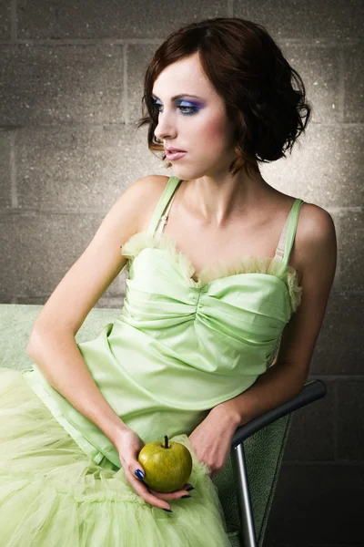 Young woman in green gown — Stock Photo, Image