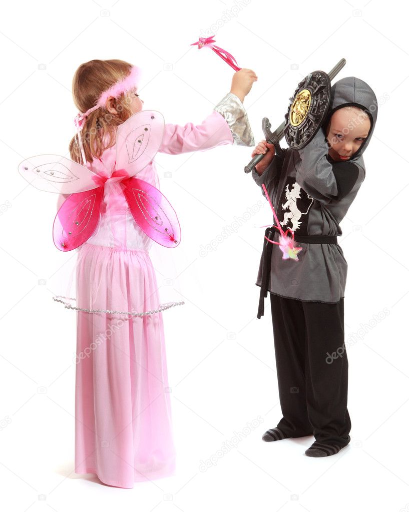 Young girl as magic fairy and boy dressed as a Knight isolated