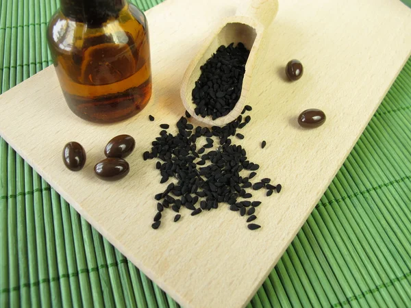 Siyah Kimyon tohumu, yağ ve kapsül — Stok fotoğraf