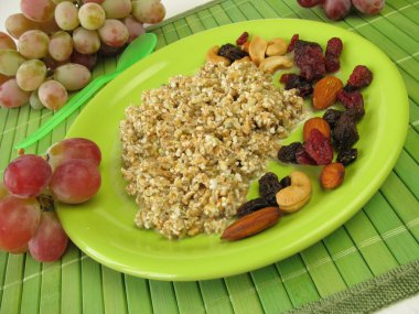 Fresh grain muesli with nuts and dried fruits clipart