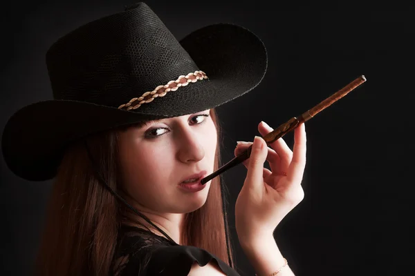 The girl in a cowboy's hat and with a mouthpiece — Stock Photo, Image