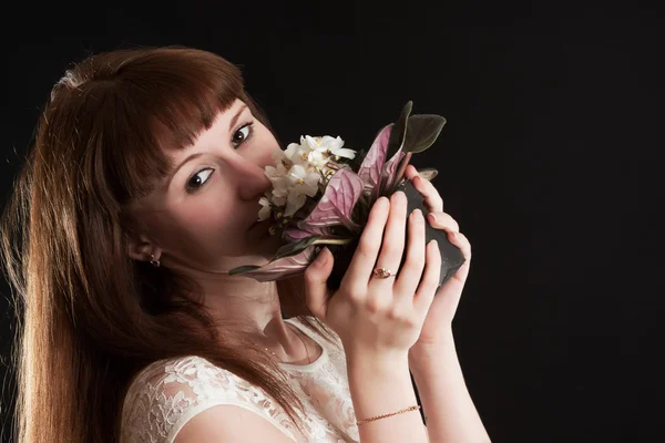 The girl with white violets — Stock Photo, Image