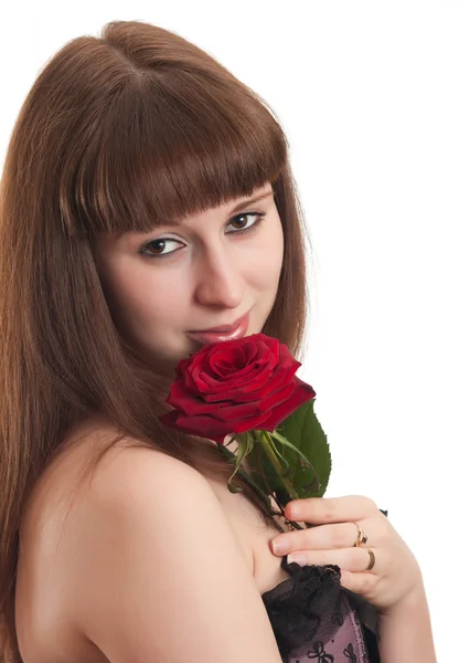 La chica con una rosa sobre un fondo blanco — Foto de Stock
