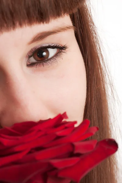Das Mädchen mit einer Rose auf weißem Hintergrund — Stockfoto