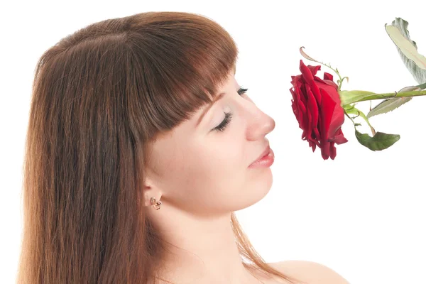 Het meisje met een roos op een witte achtergrond — Stockfoto